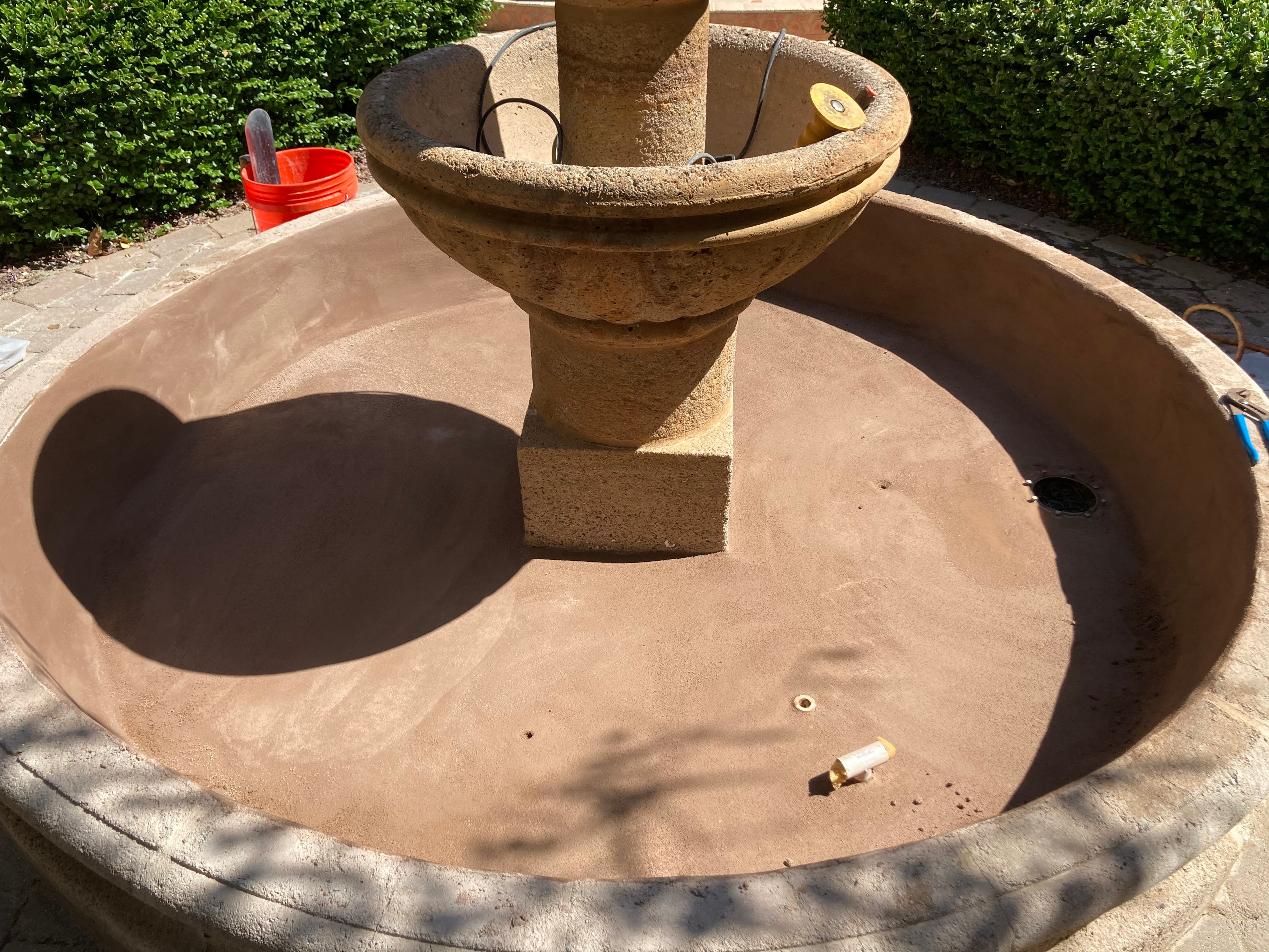 Fountain basin after resurfacing — smooth fresh finish